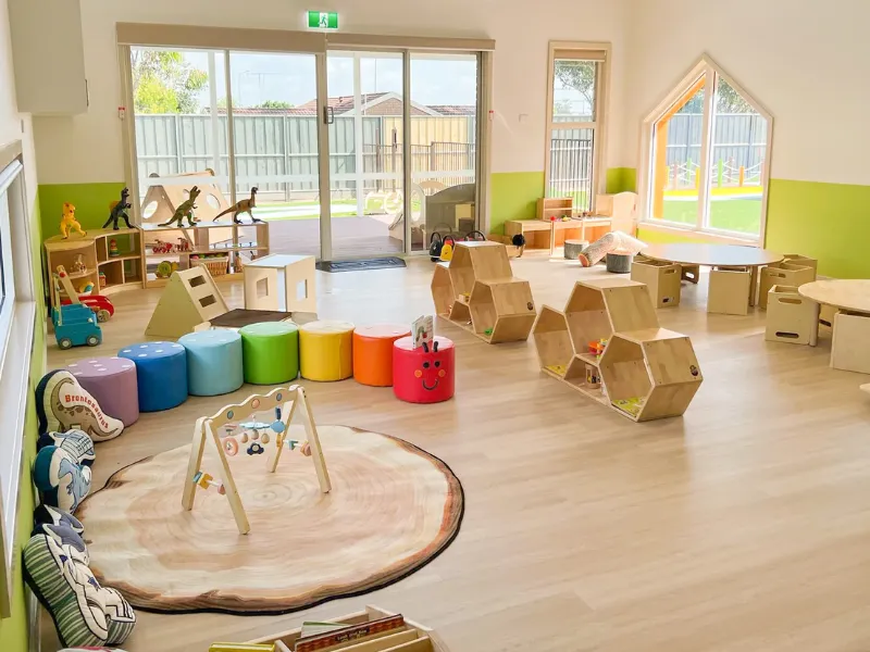 Reggio Emilia inspired light table with natural materials for sensory exploration