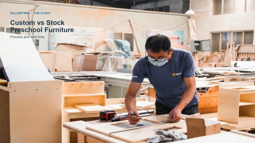 Factory worker marking a preschool cabinet panel against the drawing; title: Custom vs Stock Preschool Furniture — process and lead time