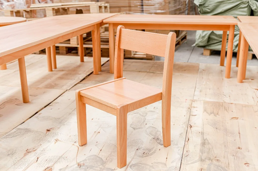 Solid beech preschool classroom chair photographed on the factory floor