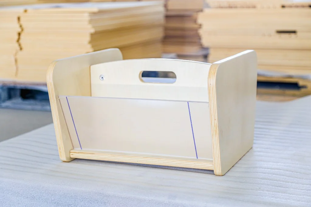Small birch preschool book browser with a front display pocket and carry handle