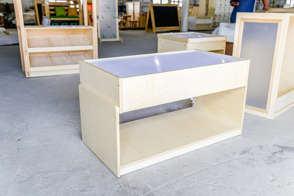 Rectangular birch preschool light table with a frosted top and open storage underneath
