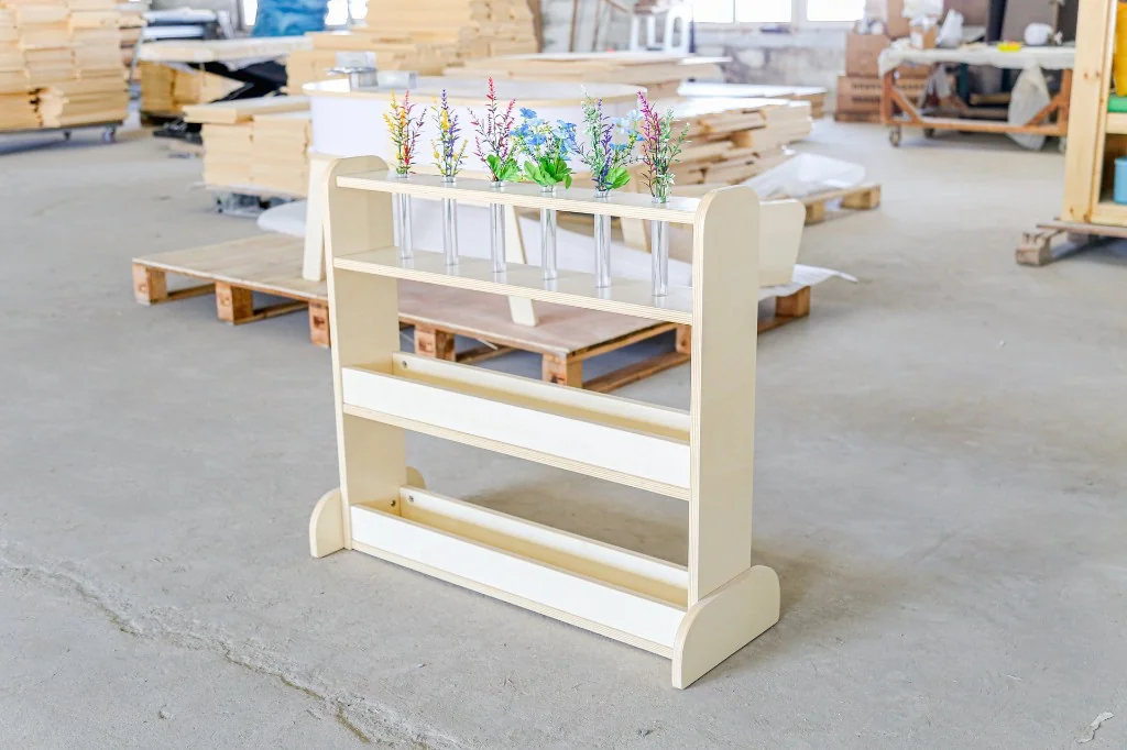 Birch preschool nature stand with glass tubes of flowers and two display trays