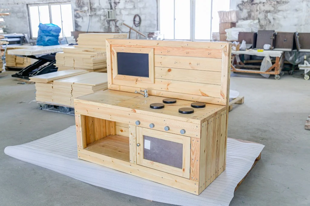 Solid pine preschool play kitchen with sink, stove burners, chalkboard and oven door