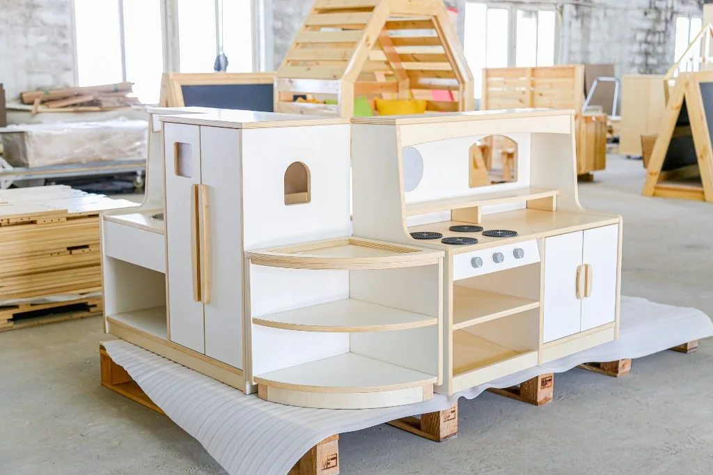 Modular white preschool play kitchen with fridge, corner shelf and stove hutch